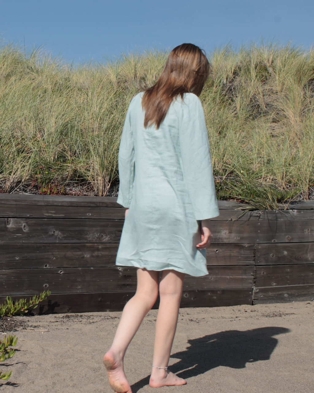 Back view of meadow green linen midi dress