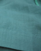 European linen fabric seams in meadow green
